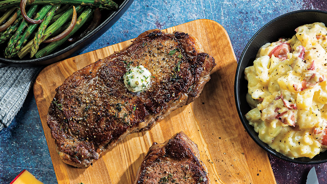 PanRoasted Strip Steaks with Gouda Smashed Red Potato Skins